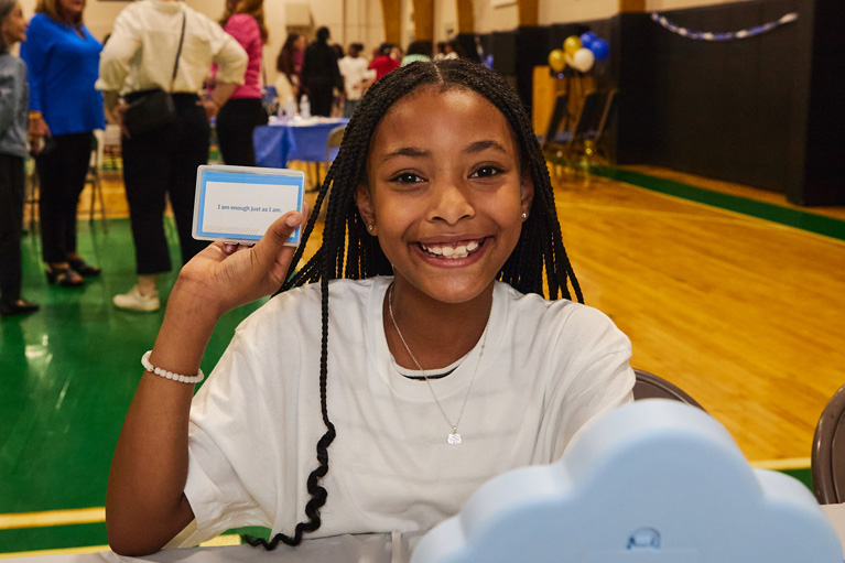 Club girl smiling at camera during Dove event