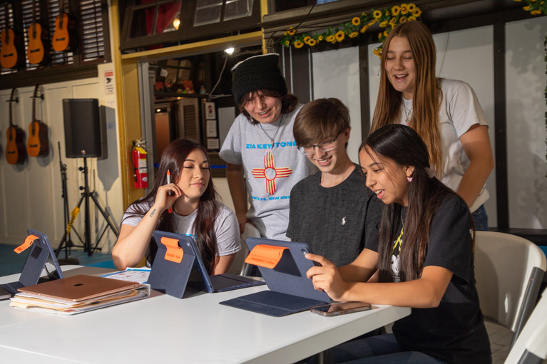 Club teens working on a project