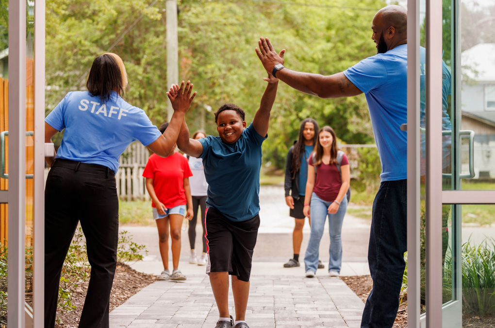 Boys &amp; Girls Club youth entering Club