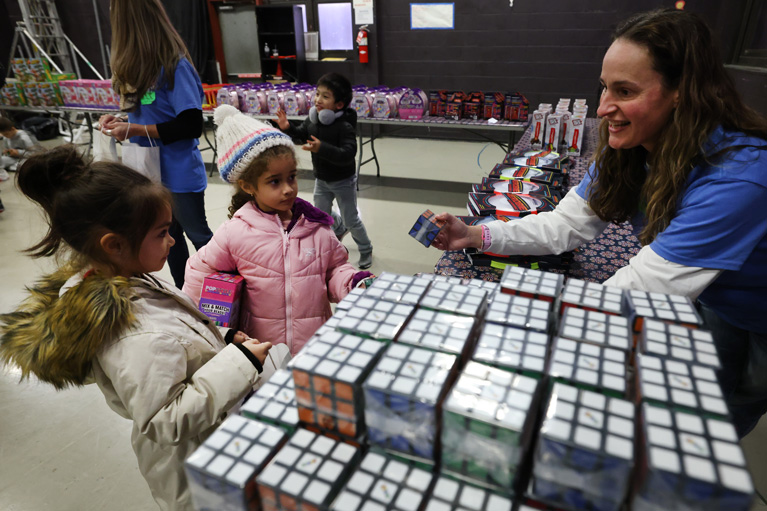Club kids being given Rubik's Cubes