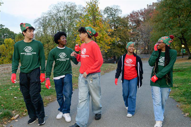 5 East Harlem teens spread kindness by debuting original designs at Coca-Cola’s Holiday Caravan.