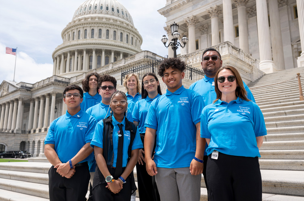 Club kids standing on stairs at United States Capitol