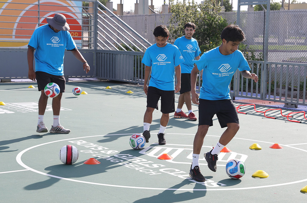 Club kids playing soccer