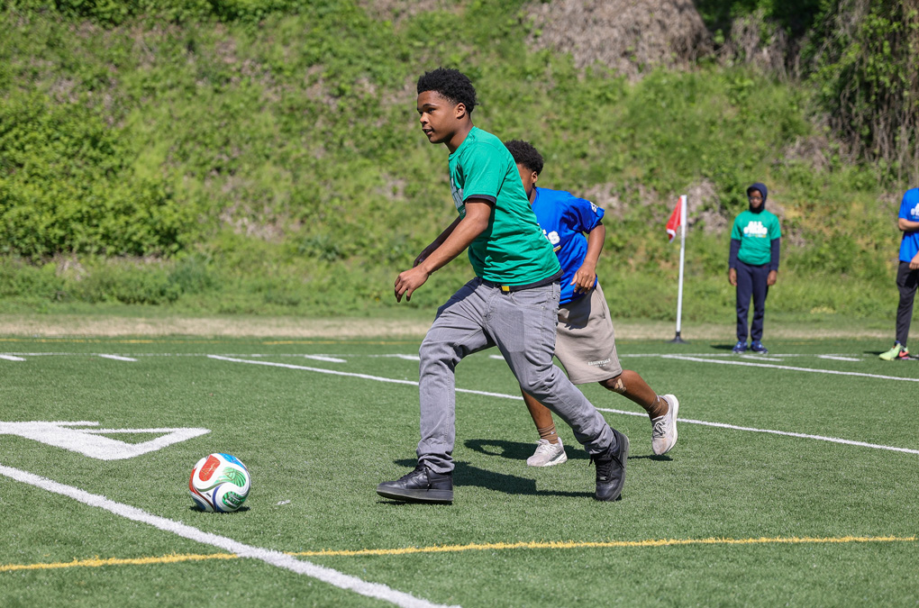 Club kids playing soccer